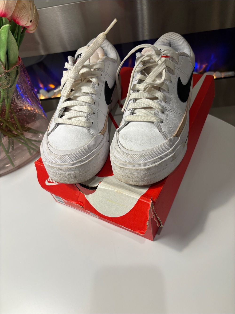 Nike White Sneakers with Black Swoosh and Red Accent